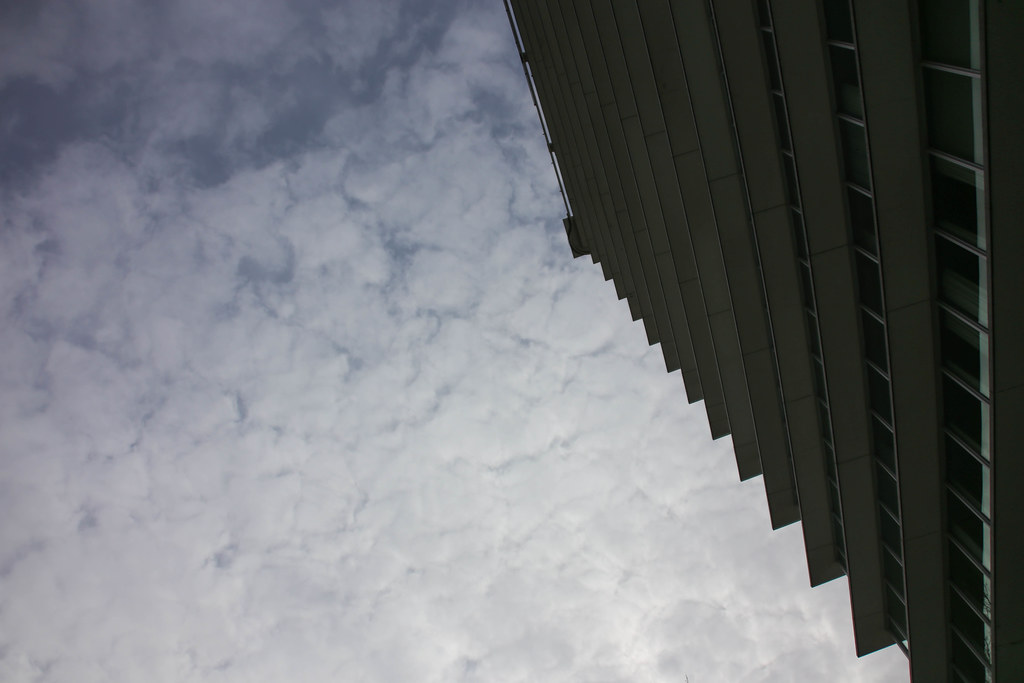 Modern apartment building with balconies against a blue sky