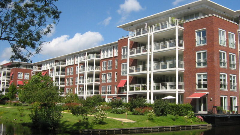 Modern new-build apartment block with clean lines and balconies