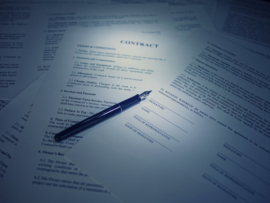Legal contract with a pen ready for signature
