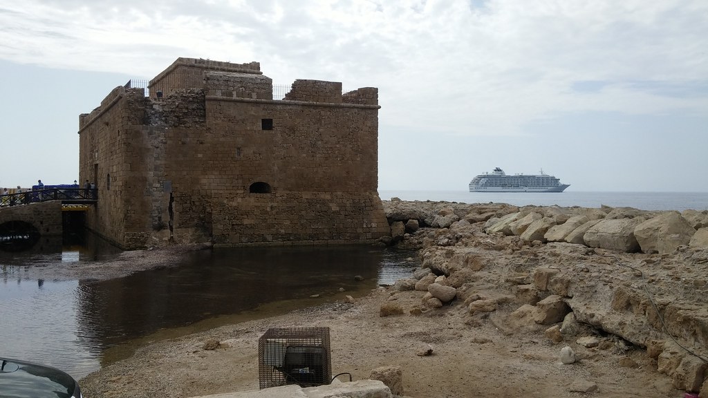Paphos harbour with the medieval fort and a cruise ship in Cyprus