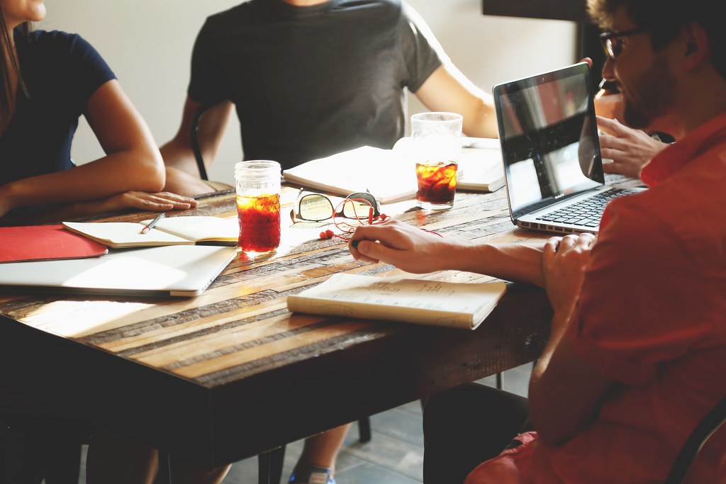 People working on laptops in a shared startup workspace