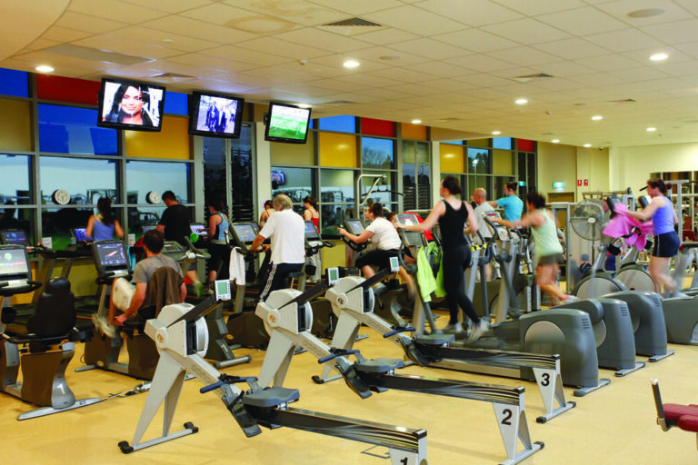 Gym floor with cardio machines and weight equipment
